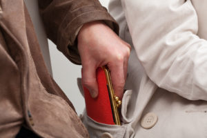 a man holding a red wallet in his hand