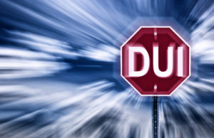 a stop sign with the words dui on it