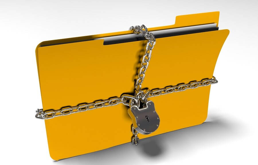 a file folder with a chain and padlock