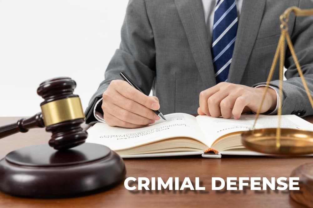 criminal defense, featuring a gavel, handcuffs, and legal documents on a desk. 