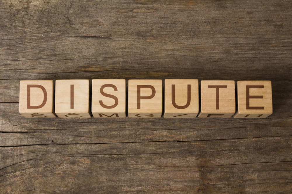 Dispute written on wooden blocks